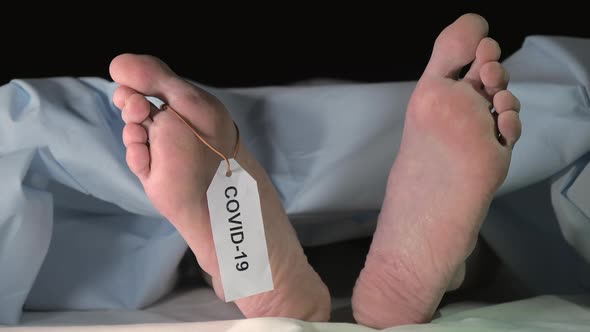 A Moving Toes of the Dead Body on the Bed