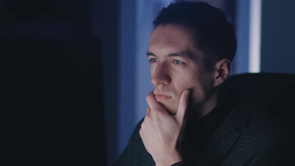 Confident Businessman Man Working at Laptop Computer Late at Night