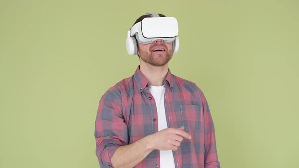 Adult Man in Vr Glasses on Camera Playing with 3D Visual Simulation alt