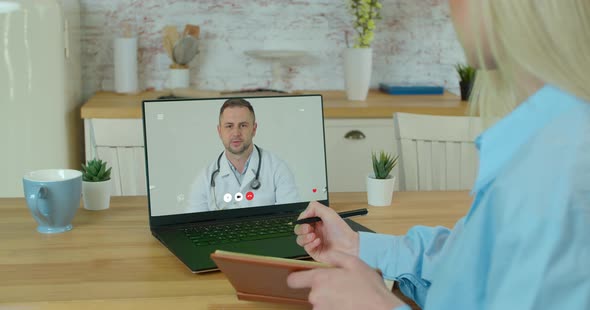 Woman Checks Possible Symptoms with Professional Physician, Using Online Video Chat. Young Girl Sick alt