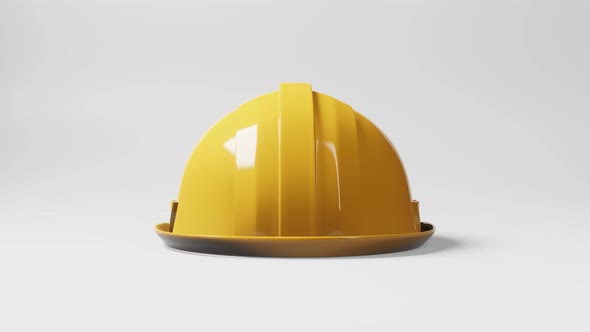 Seamless looping yellow hardhat construction helmet motion rotating