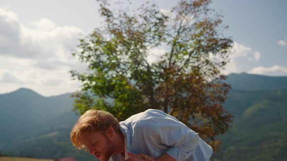 Playful Father Playing Son on Green Mountain alt