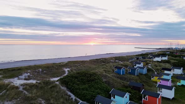 Drone View of Sweden Ocean Shore with Fishing Cabins at the Sunset