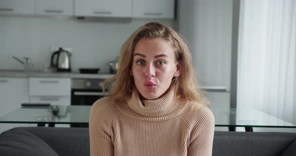 Positive Crazy Cheerful Glad Funny Lady Wow Sale Reaction in Sitting Couch Kitchen Bacground alt