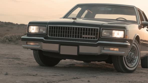 Black classic car image ve sunset alt