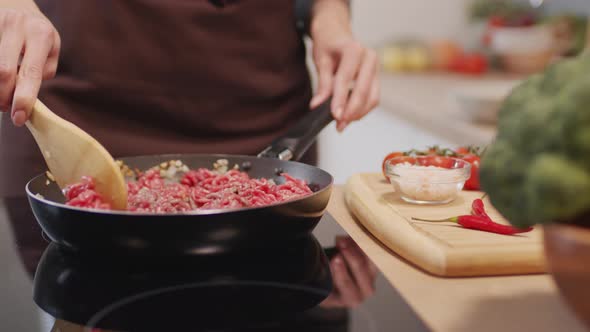 Preparing Ground Beef Meat on Frying Pan alt