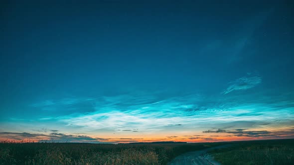 Time Lapse Night Starry Sky With Glowing Stars Above Countryside Landscape With Country Road And alt