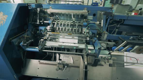 Typography Mechanism Is Binding Printed Paper Pages alt