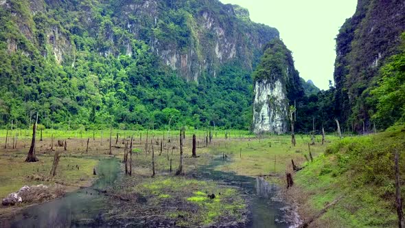 Cinematic Aerial Shot Flying Through Cheow Lan Lake Khao Sok Thailand alt