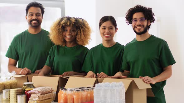 Volunteers with Food Donation Showing Thumbs Up alt