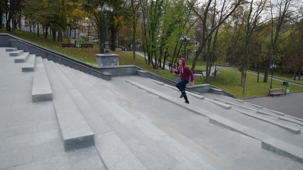 Fit Man Running Upstairs in Park alt