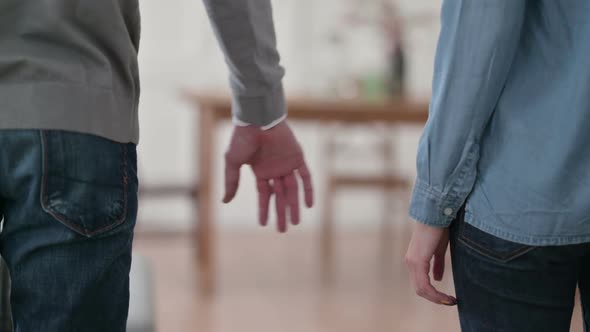 Close Up of Couple Holding Hands alt