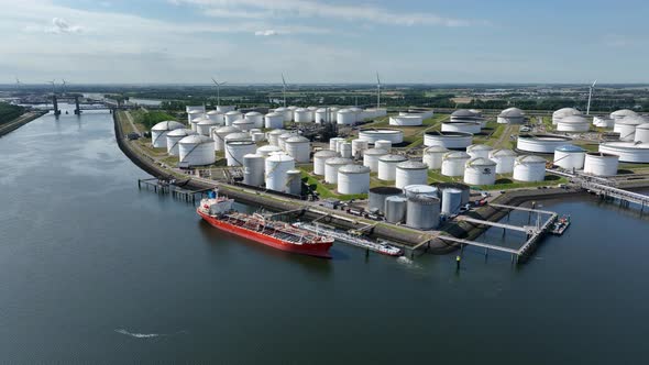 Crude Oil Liquid Cargo Transporter Ship Unloading Petrochemicals to a Fuel Depot alt