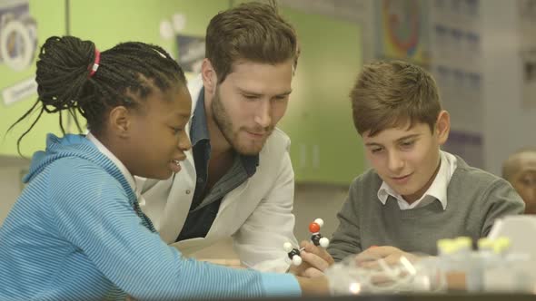 MS School children and teacher trying out a scientific equipment