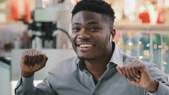Closeup Relaxed Satisfied Happy Young African American Man Sitting Listening to Modern Dynamic Music alt