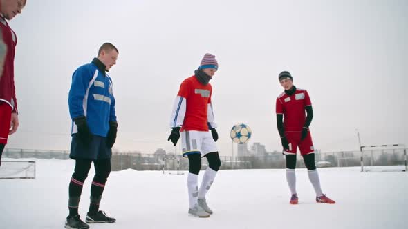 Soccer Players Juggling a Ball alt