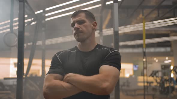 An Athlete Flying Around the Camera in a Circle with Crossed Arms alt