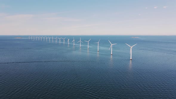 Drone Flies Over an Offshore Windmill Row in the Ocean