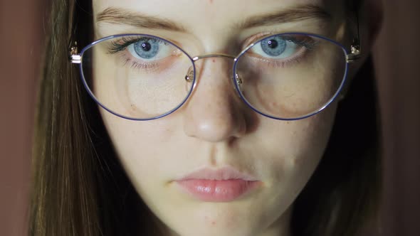 Closeup Eyes of a Teenage Girl with Glasses Looks at the Monitor Plays a Game Reads Studies alt