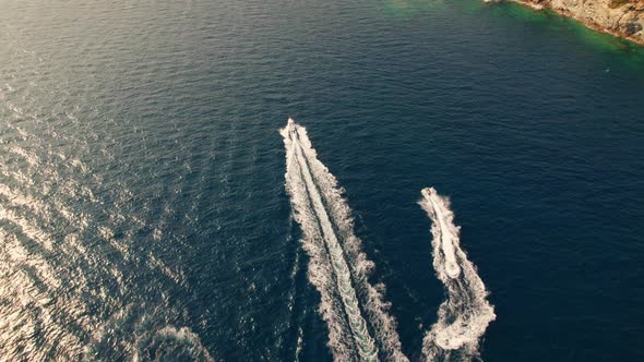 Drone Over Boats In Sea Just Off Coastline Of Cap De Creus alt