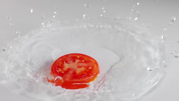 Slice of Tomato Falls Into the Water