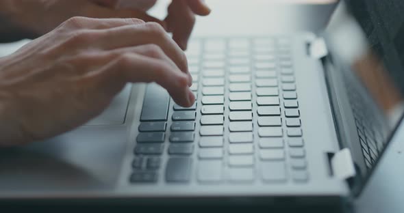 Man Hands Typing on Computer Keyboard Closeup