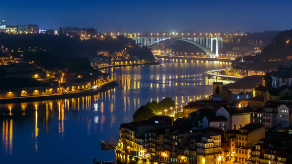 City of Porto and Gaia at Night By the Douro River Timelapse in Portugal Arrabida Bridge at the Far alt