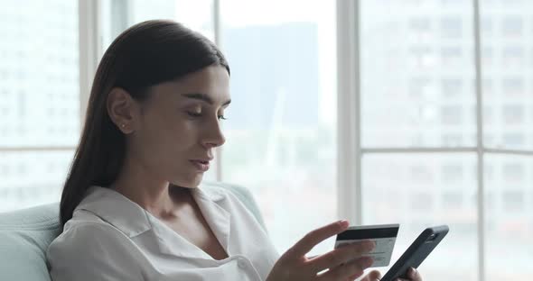 Young Woman Spending Money in Internet Websites and Mobile Apps and Stores and Making Online Mobile alt