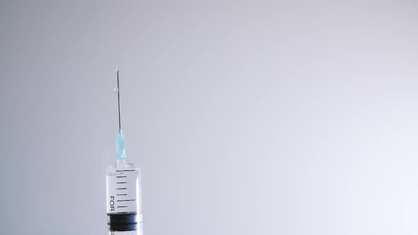 Close Up Medical Syringe Needle on White Background alt