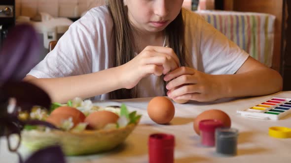 Child Girl Having Fun During Painting Eggs for Easter in Spring Time at Home alt