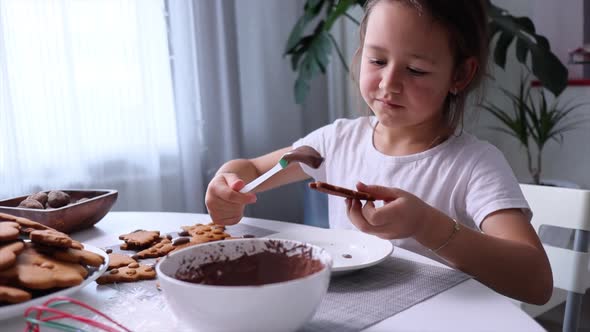 The Child Decorates Gingerbread Cookies for Holidays
