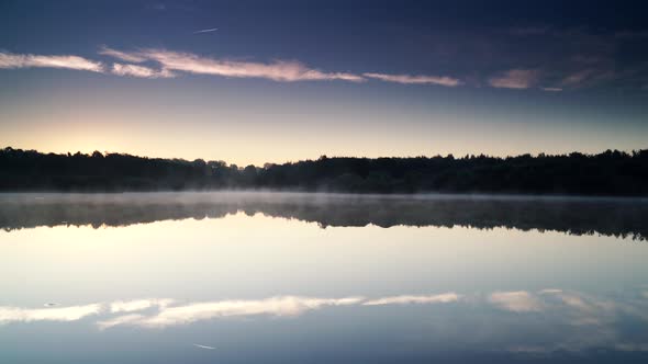 Morning Fog over Lake. Timelapse