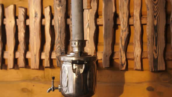 A Large Russian Kettle From Which Smoke Falls Out alt