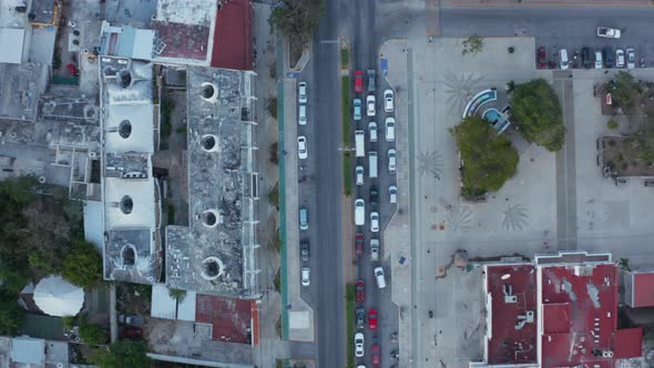 Overhead Slow Motion View of Vehicles Running on City Streets with Some Cars Taking Halt at Red alt