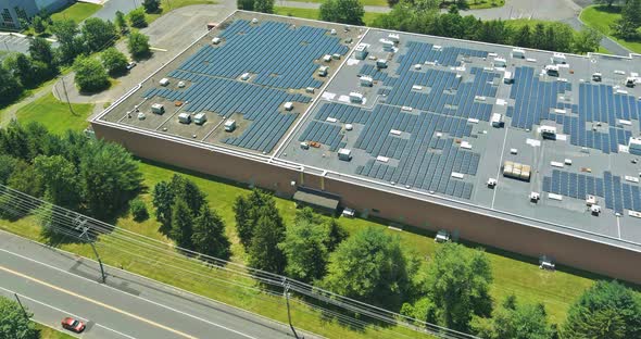 Aerial View of Solar Panels on Rooftop Comercial Building a New Alternative Energy to Save alt