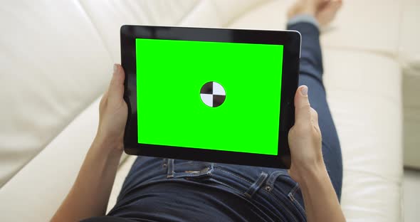 Woman with Tablet Chromakey Lying on Sofa