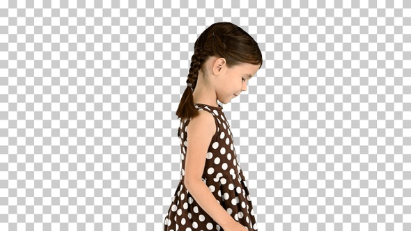 Smiling little girl in polka dot dress walking, Alpha Channel alt