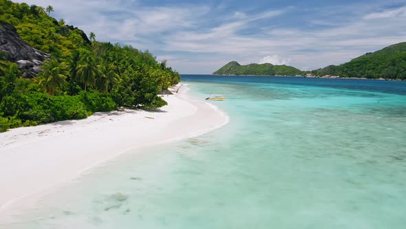 Aerial  Footage of Lonely Tourist Boat at Tropical Exotic Beach alt