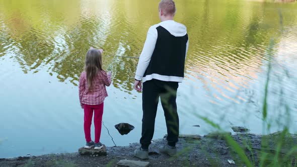 Daughter and Dad Fishing in the Summer View From the Back alt