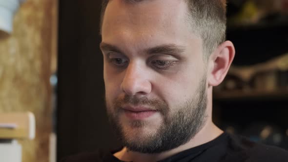 Close Up Concentrated Bearded Man Reading Book or Working on Laptop alt