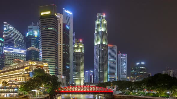 A View of Singapore Business District Skyscrapers in the Night Time with Water Reflections Timelapse alt
