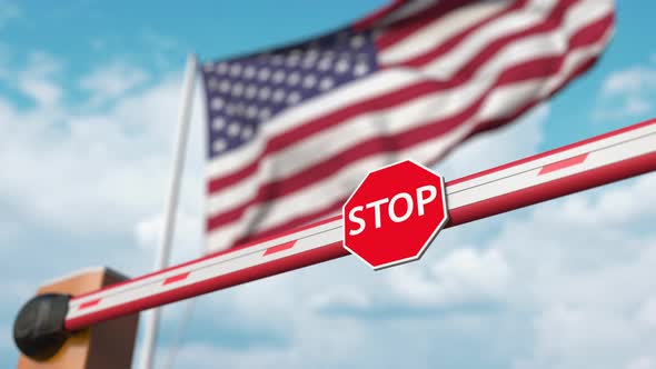 Opening Boom Barrier with Stop Sign Against the American Flag alt