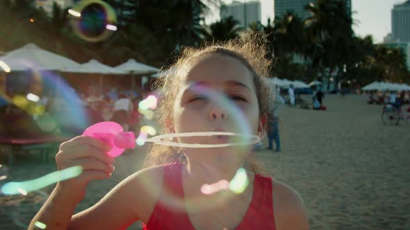 Funny Happy Little Girl Smiling Child Adorable Looking at Camera is Play on Beach alt