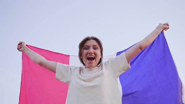 Portrait of an Emotional Woman with the Flag of France