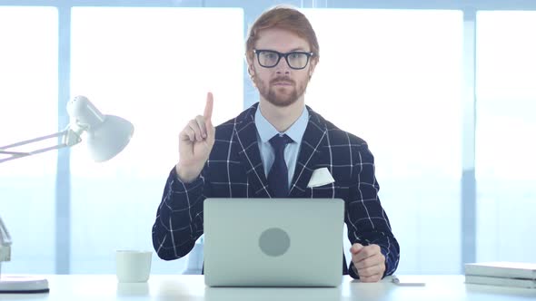 Redhead Businessman Denying Offer by Waving Finger, Rejecting alt
