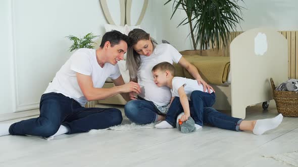 Family of Three in Expectation of Baby alt