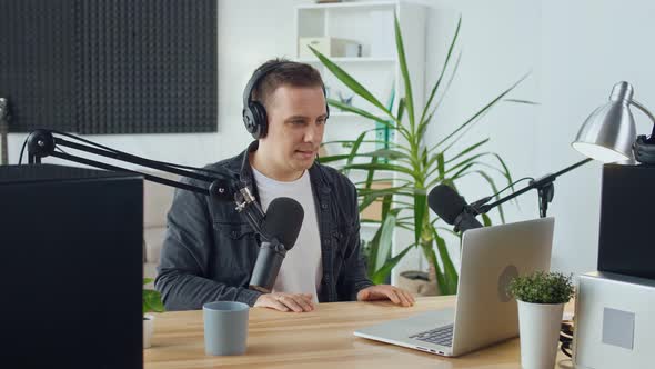 The Streamer Hosts a Podcast and Answers Questions While Working at the Computer alt