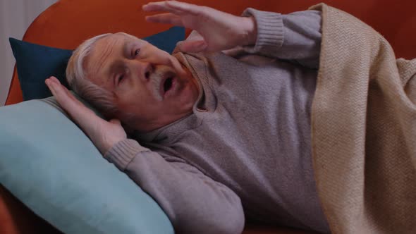 Scared Tired Senior Man Wakes Up From Bad Nightmare in Bedroom at Home Stress Nervousness Anxiety alt