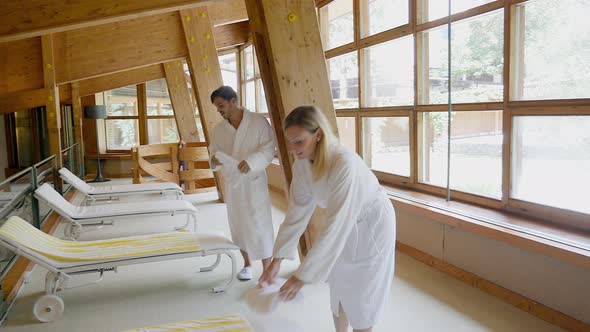 Couple in white bathrobes at spa resort, Alta Badia, Italy