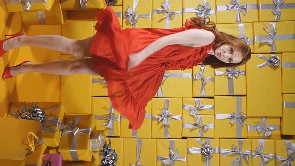 A Beautiful Lady Jumps with Happiness After Receiving a Bunch of Birthday Gifts Celebrates a Party alt